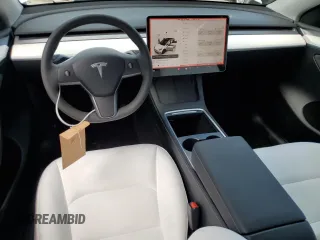 2025 Tesla Model Y Long Range with VIN 7SAYGDED4SF232433, listed as a Copart auction lot 51504015 with Not Provided miles and Salvage Title. Bid and sale history available at DreamBid. Image 8.