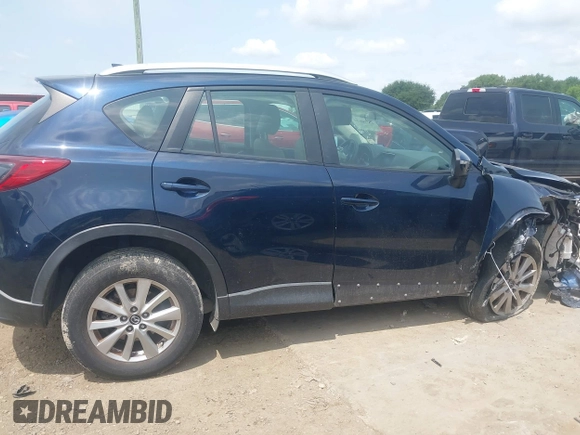 2016 Mazda CX-5 Sport z VIN JM3KE2BY0G0633611, wystawiony jako IAAI lot #42390654 z przebiegiem Nie podano mil oraz . Historia ofert i sprzedaży dostępna na DreamBid. Obrazek 14.