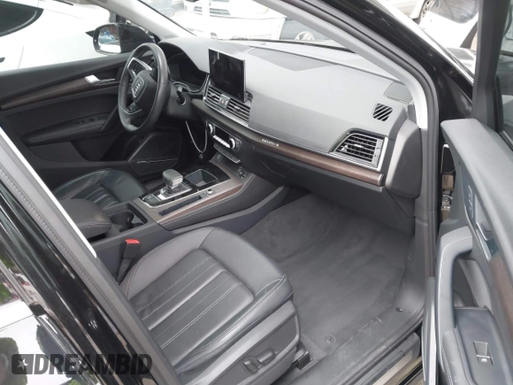 2023 Audi Q5 Premium Plus z VIN WA1BBAFY7P2187588, wystawiony jako IAAI lot #42052046 z przebiegiem 18 987 mil mil oraz . Historia ofert i sprzedaży dostępna na DreamBid. Obrazek 5.