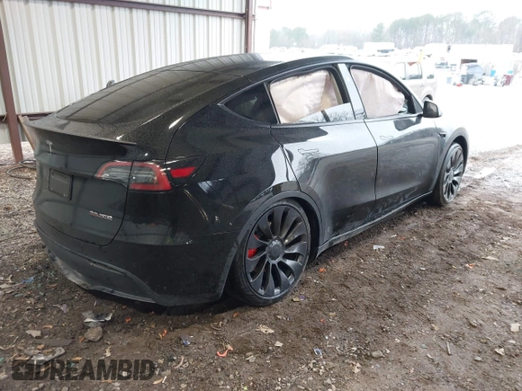 2023 Tesla Model Y Performance with VIN 7SAYGDEF2PF800641, listed as a IAAI auction lot 41612596 with 60,984 mi miles and . Bid and sale history available at DreamBid. Image 4.