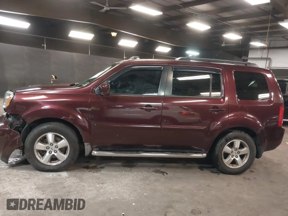 2009 Honda Pilot EX-L with VIN 5FNYF48569B021586, listed as a IAAI auction lot 41609721 with 291,598 mi miles. Bid and sale history available at carsss.com. Image 14.