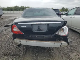 2004 Jaguar XJ VDP with VIN SAJWA74C64SG27143, listed as a Copart auction lot 71373744 with 129,942 mi miles and Salvage Title. Bid and sale history available at carsss.com. Image 6.
