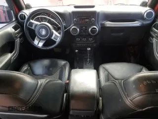 2013 Jeep Wrangler Unlimited Freedom z VIN 1C4BJWDG7DL582764, wystawiony jako Copart lot #54133275 z przebiegiem 183 507 mil mil oraz Szkoda całkowita • Salvage title. Historia ofert i sprzedaży dostępna na DreamBid. Obrazek 8.
