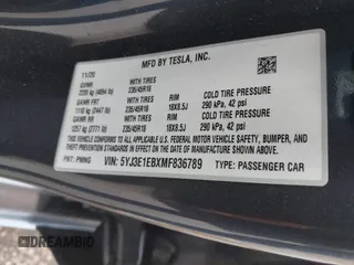 2021 Tesla Model 3 Long Range with VIN 5YJ3E1EBXMF836789, listed as a IAAI auction lot 41900027 with 71,086 mi miles. Bid and sale history available at carsss.com. Image 9.