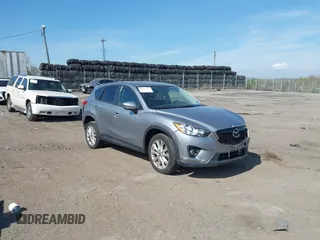 2014 Mazda CX-5 Grand Touring with VIN JM3KE4DY7E0311893, listed as a IAAI auction lot 42090872 with 102,154 mi miles and . Bid and sale history available at DreamBid. Image 1.