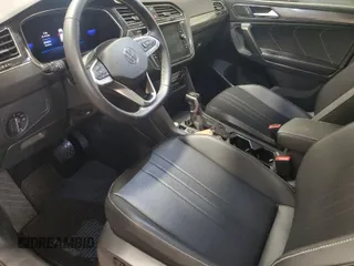 2023 Volkswagen Tiguan SE with VIN 3VV2B7AX5PM105309, listed as a IAAI auction lot 42026255 with 25,546 mi miles and . Bid and sale history available at DreamBid. Image 1.