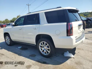 2015 GMC Yukon Denali with VIN 1GKS2CKJ3FR663324, listed as a Copart auction lot 70306614 with 154,234 mi miles and Salvage Title. Bid and sale history available at carsss.com. Image 2.
