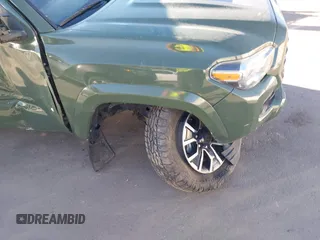 2021 Toyota Tacoma SR with VIN 3TYCZ5AN2MT039450, listed as a IAAI auction lot 40457613 with 54,176 mi miles and . Bid and sale history available at DreamBid. Image 6.