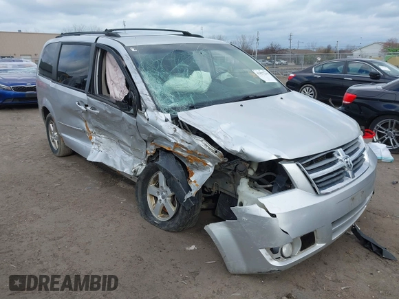 2010 Dodge Grand Caravan SXT with VIN 2D4RN5D13AR180609, listed as a IAAI auction lot 41857215 with Not Provided miles and . Bid and sale history available at DreamBid. Image 1.