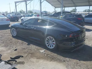 2014 Tesla Model S 60 z VIN 5YJSA1H13EFP42250, wystawiony jako IAAI lot #42267590 z przebiegiem 196 142 mil mil oraz . Historia ofert i sprzedaży dostępna na DreamBid. Obrazek 3.