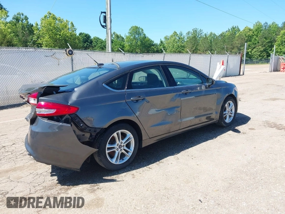 2018 Ford Fusion SE z VIN 3FA6P0H71JR155221, wystawiony jako IAAI lot #42145081 z przebiegiem 189 367 mil mil oraz . Historia ofert i sprzedaży dostępna na DreamBid. Obrazek 4.