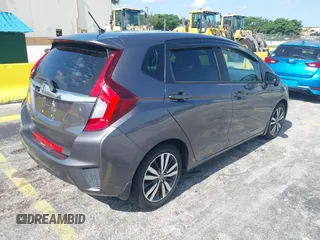 2015 Honda Fit EX-L z VIN 3HGGK5H89FM730013, wystawiony jako IAAI lot #42673309 z przebiegiem 142 660 mil mil oraz . Historia ofert i sprzedaży dostępna na DreamBid. Obrazek 4.