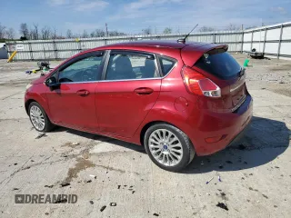 2014 Ford Fiesta Titanium z VIN 3FADP4FJ0EM156814, wystawiony jako Copart lot #52028435 z przebiegiem 97 985 mil mil oraz Szkoda całkowita • Salvage title. Historia ofert i sprzedaży dostępna na DreamBid. Obrazek 2.