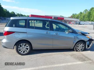 2012 Mazda 5 Sport with VIN JM1CW2BLXC0129303, listed as a IAAI auction lot 42556899 with 200,863 mi miles and . Bid and sale history available at DreamBid. Image 14.