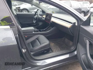 2019 Tesla Model 3 Mid Range with VIN 5YJ3E1EA3KF307415, listed as a IAAI auction lot 41673239 with 42,895 mi miles and . Bid and sale history available at DreamBid. Image 5.