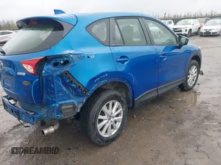 2014 Mazda CX-5 Sport with VIN JM3KE4BE6E0336504, listed as a IAAI auction lot 41961244 with 125,150 mi miles. Bid and sale history available at carsss.com. Image 4.