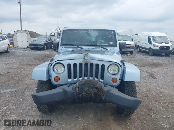 2012 Jeep Wrangler Arctic with VIN 1C4AJWBG7CL148325, listed as a IAAI auction lot 39943602 with 86,625 mi miles and . Bid and sale history available at DreamBid. Image 12.