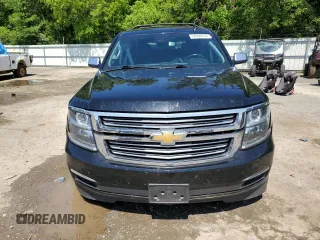 2018 Chevrolet Tahoe Premier with VIN 1GNSKCKC1JR133625, listed as a Copart auction lot 54900974 with 130,921 mi miles and Salvage title. Bid and sale history available at DreamBid. Image 5.