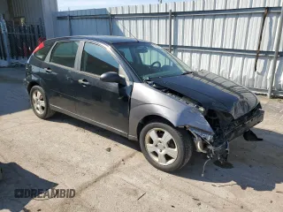 2007 Ford Focus S z VIN 1FAHP37N07W161088, wystawiony jako Copart lot #54140415 z przebiegiem 241 367 mil mil oraz Szkody całkowita. Historia ofert i sprzedaży dostępna na DreamBid. Obrazek 4.