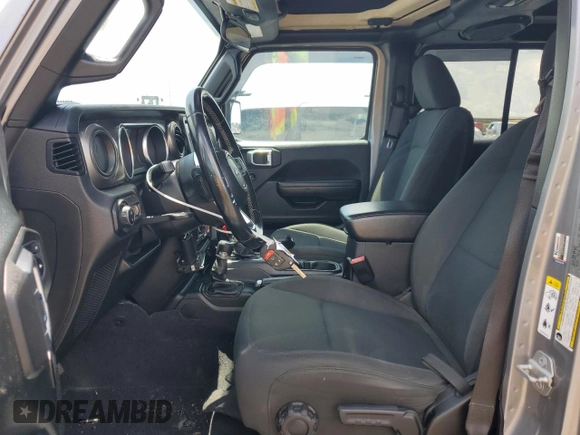 2020 Jeep Gladiator Sport S with VIN 1C6JJTAG9LL149872, listed as a Copart auction lot 58518095 with 118,910 mi miles and Salvage title. Bid and sale history available at DreamBid. Image 7.