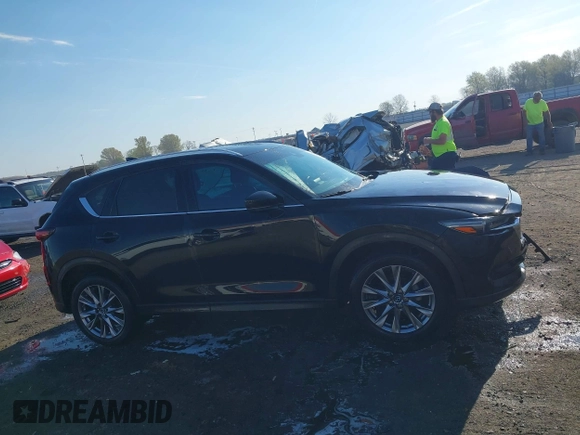 2020 Mazda CX-5 Grand Touring with VIN JM3KFBDM0L0790508, listed as a IAAI auction lot 41883319 with 114,398 mi miles and . Bid and sale history available at carsss.com. Image 13.