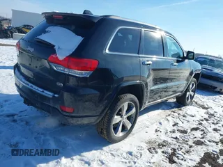 2015 Jeep Grand Cherokee Overland z VIN 1C4RJFCG3FC726748, wystawiony jako IAAI lot #41369715 z przebiegiem 120 905 mil mil oraz . Historia ofert i sprzedaży dostępna na DreamBid. Obrazek 4.