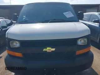 2014 Chevrolet Express Cargo Van with VIN 1GCWGFCG0E1100859, listed as a IAAI auction lot 42142748 with 182,900 mi miles. Bid and sale history available at carsss.com. Image 6.