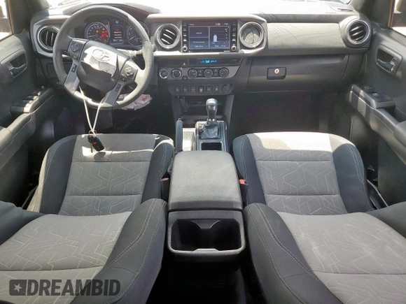 2023 Toyota Tacoma SR z VIN 3TMCZ5AN5PM598443, wystawiony jako Copart lot #60485035 z przebiegiem 18 842 mil mil oraz Szkoda całkowita • Salvage title. Historia ofert i sprzedaży dostępna na DreamBid. Obrazek 8.