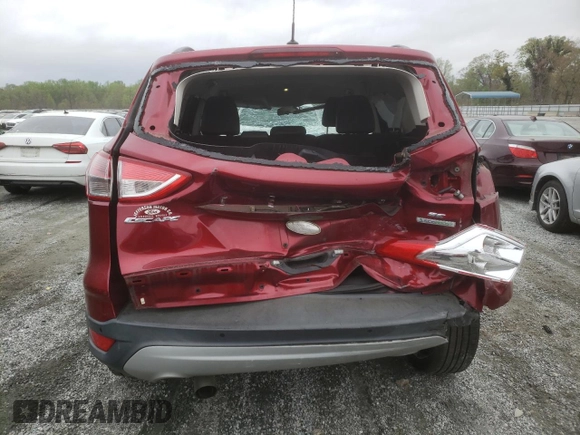 2014 Ford Escape SE with VIN 1FMCU0GXXEUD05991, listed as a Copart auction lot 51440465 with 129,445 mi miles and Salvage Title. Bid and sale history available at carsss.com. Image 6.
