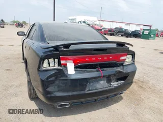 2014 Dodge Charger SXT with VIN 2C3CDXHG3EH122158, listed as a IAAI auction lot 41861010 with 122,842 mi miles. Bid and sale history available at carsss.com. Image 3.