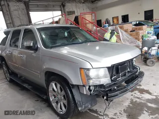 2011 Chevrolet Suburban LTZ with VIN 1GNSCKE05BR179971, listed as a IAAI auction lot 41510322 with 223,741 mi miles. Bid and sale history available at carsss.com. Image 1.