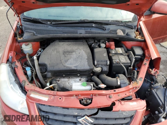 2013 Suzuki SX4 Crossover z VIN JS2YB5A37D6100222, wystawiony jako Copart lot #86614504 z przebiegiem 131 930 mil mil oraz Szkoda całkowita • Salvage title. Historia ofert i sprzedaży dostępna na DreamBid. Obrazek 12.
