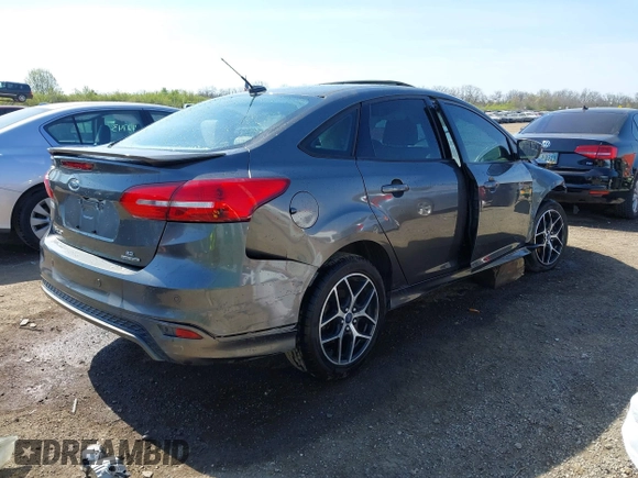 2015 Ford Focus SE with VIN 1FADP3F29FL268677, listed as a IAAI auction lot 42037244 with 118,018 mi miles. Bid and sale history available at carsss.com. Image 4.
