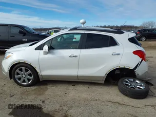 2016 Buick Encore Premium with VIN KL4CJDSB3GB607132, listed as a IAAI auction lot 41526249 with 50,617 mi miles and . Bid and sale history available at carsss.com. Image 14.