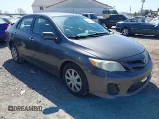2011 Toyota Corolla L with VIN JTDBU4EE4B9144190, listed as a IAAI auction lot 42060728 with 115,299 mi miles. Bid and sale history available at carsss.com. Image 1.