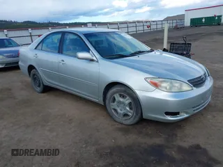 2004 Toyota Camry LE with VIN JTDBE32K640257695, listed as a IAAI auction lot 41837872 with 214,917 mi miles. Bid and sale history available at carsss.com. Image 1.