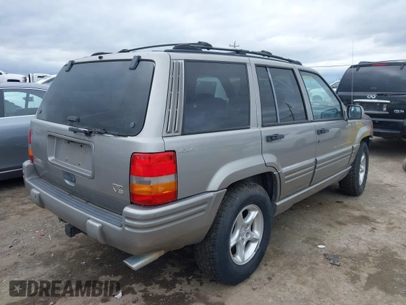 1998 Jeep Grand Cherokee Limited with VIN 1J4GZ88Z7WC223496, listed as a IAAI auction lot 41484317 with 244,567 mi miles. Bid and sale history available at carsss.com. Image 4.