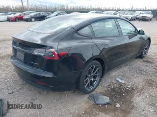 2021 Tesla Model 3 Long Range with VIN 5YJ3E1EB4MF012822, listed as a IAAI auction lot 41918721 with 69,105 mi miles. Bid and sale history available at carsss.com. Image 4.