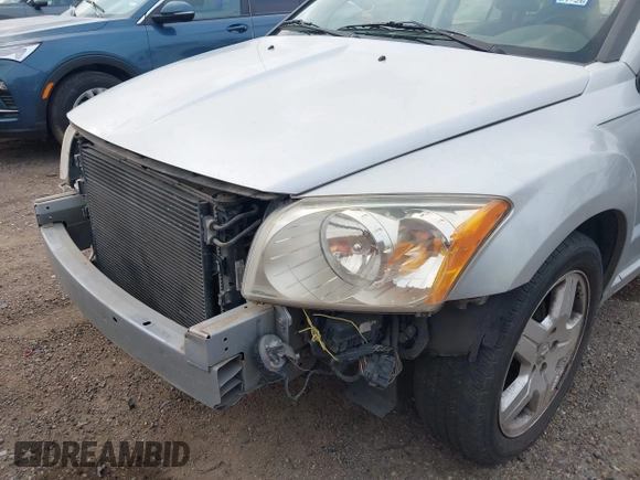2009 Dodge Caliber SXT with VIN 1B3HB48A59D143888, listed as a IAAI auction lot 42110334 with 182,674 mi miles and . Bid and sale history available at DreamBid. Image 6.