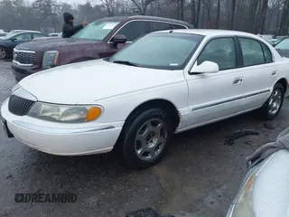 2001 Lincoln Continental with VIN 1LNHM97V51Y670610, listed as a IAAI auction lot 41439804 with 160,114 mi miles. Bid and sale history available at carsss.com. Image 2.