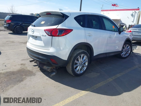 2015 Mazda CX-5 Grand Touring with VIN JM3KE4DY5F0526335, listed as a IAAI auction lot 41756046 with 1 mi miles. Bid and sale history available at carsss.com. Image 4.
