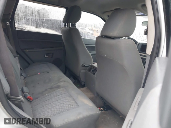 2005 Jeep Grand Cherokee Laredo z VIN 1J4GR48K05C506865, wystawiony jako IAAI lot #41539102 z przebiegiem 237 208 mil mil oraz . Historia ofert i sprzedaży dostępna na DreamBid. Obrazek 8.