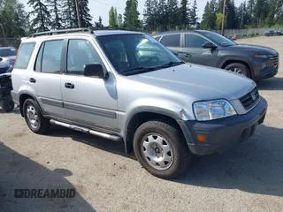 1999 Honda CR-V LX with VIN JHLRD1840XC057285, listed as a IAAI auction lot 42126071 with 99,000 mi miles. Bid and sale history available at carsss.com. Image 1.