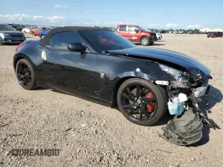 2014 Nissan 370Z Touring with VIN JN1AZ4FH3EM621279, listed as a Copart auction lot 52284814 with 60,479 mi miles and Salvage Title. Bid and sale history available at DreamBid. Image 4.