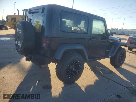 2010 Jeep Wrangler Rubicon with VIN 1J4BA6D10AL203265, listed as a Copart auction lot 79570754 with 114,840 mi miles and Salvage title. Bid and sale history available at DreamBid. Image 3.
