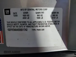 2005 Cadillac XLR z VIN 1G6YV34A455601742, wystawiony jako Copart lot #77878544 z przebiegiem Nie podano mil oraz Szkody całkowita. Historia ofert i sprzedaży dostępna na DreamBid. Obrazek 13.