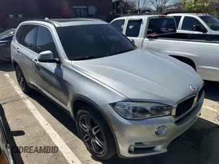 2015 BMW X5 xDrive35i with VIN 5UXKR0C57F0P14432, listed as a IAAI auction lot 42076389 with 119,109 mi miles. Bid and sale history available at carsss.com. Image 1.