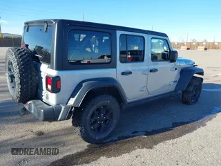 2023 Jeep Wrangler z VIN 1C4JJXN62PW628429, wystawiony jako IAAI lot #40861135 z przebiegiem 33 923 mil mil oraz . Historia ofert i sprzedaży dostępna na DreamBid. Obrazek 4.