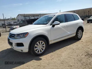 2012 Volkswagen Touareg Sport with VIN WVGEF9BP3CD011165, listed as a Copart auction lot 48913935 with 118,839 mi miles and Salvage Title. Bid and sale history available at DreamBid. Image 1.