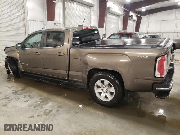 2015 GMC Canyon 4WD SLE z VIN 1GTG6BE3XF1242163, wystawiony jako Copart lot #57132035 z przebiegiem 110 241 mil mil oraz Szkoda całkowita • Salvage title. Historia ofert i sprzedaży dostępna na DreamBid. Obrazek 2.